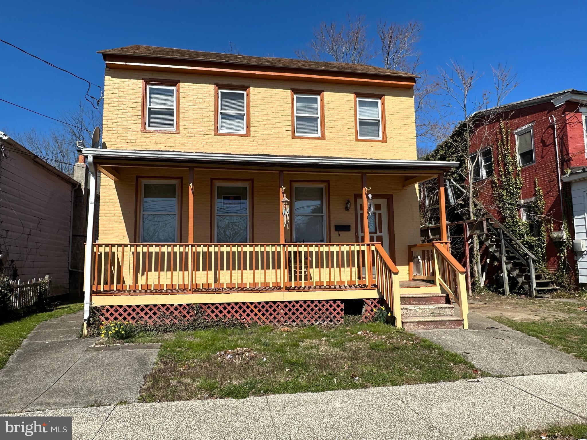 39 Yorke Street Salem, NJ 08079 - Photo 4 of 88 a view of a house with a small yard and wooden fence