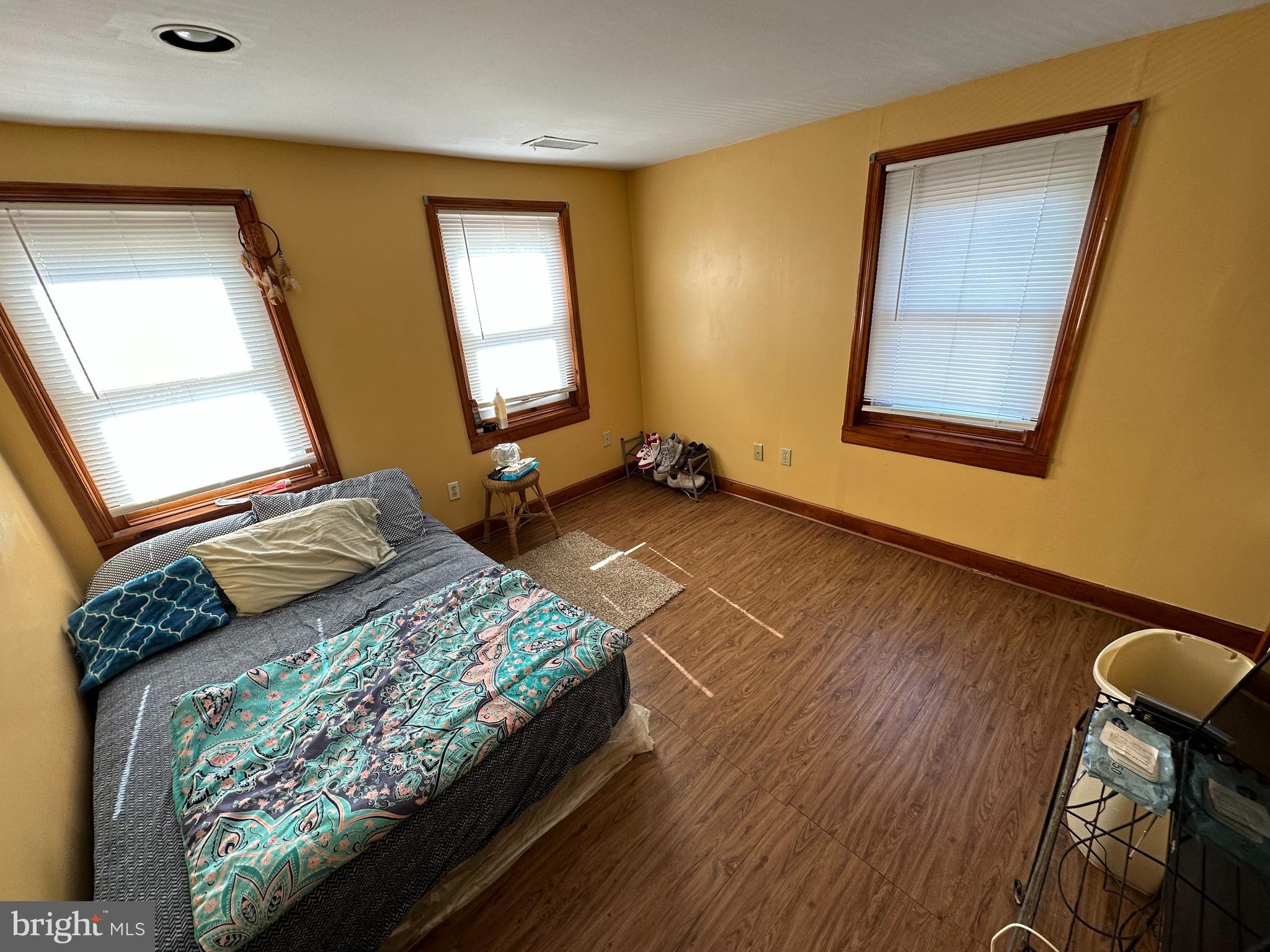 39 Yorke Street Salem, NJ 08079 - Photo 44 of 88 a bedroom with a bed and wooden floor