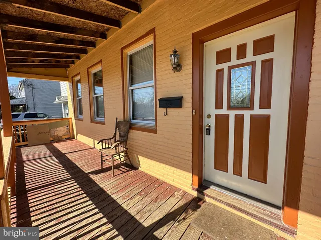 a kitchen with stainless steel appliances granite countertop a stove and a wooden floors