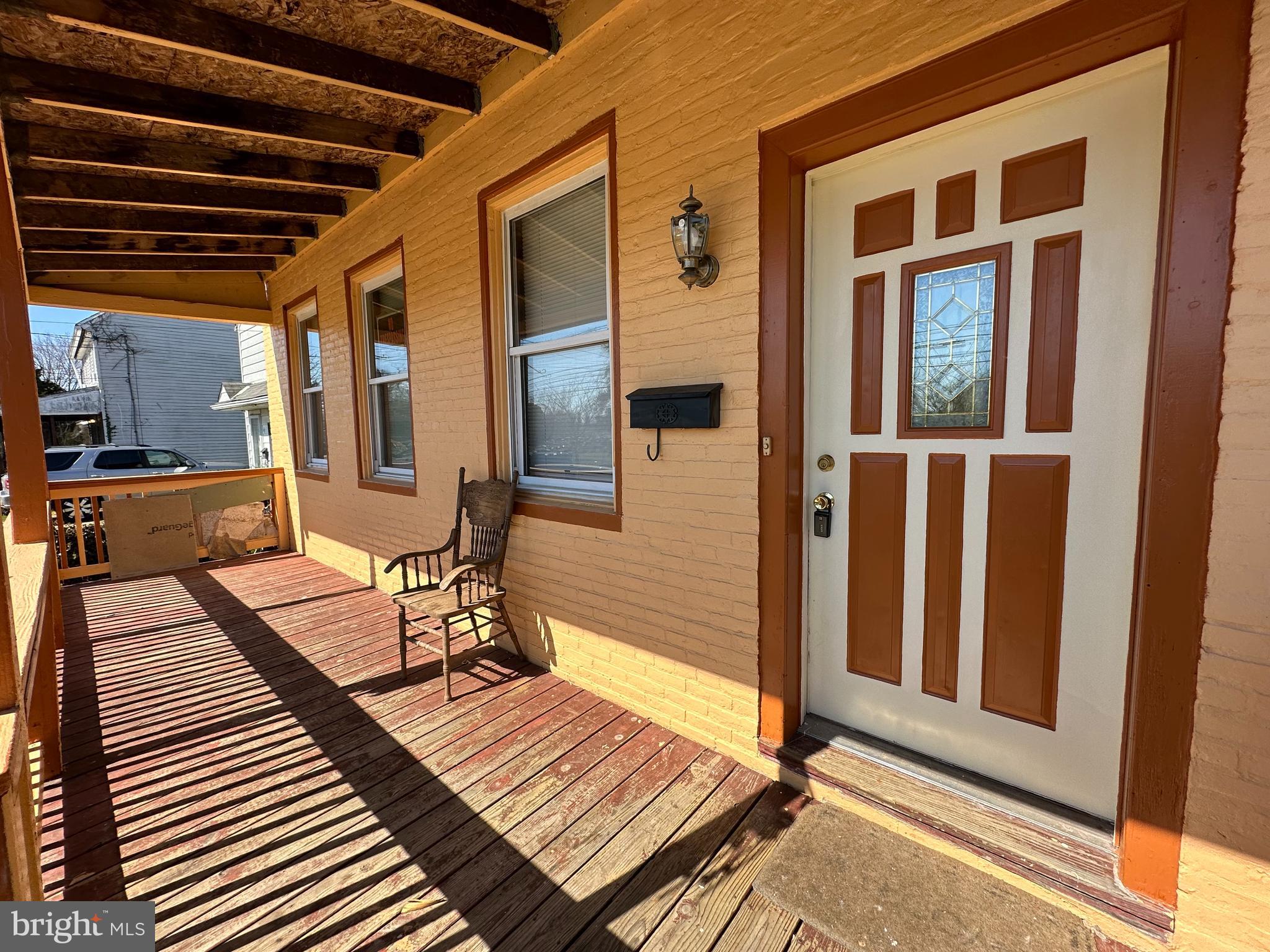 39 Yorke Street Salem, NJ 08079 - Photo 9 of 88 a view of a balcony with wooden floor and furniture
