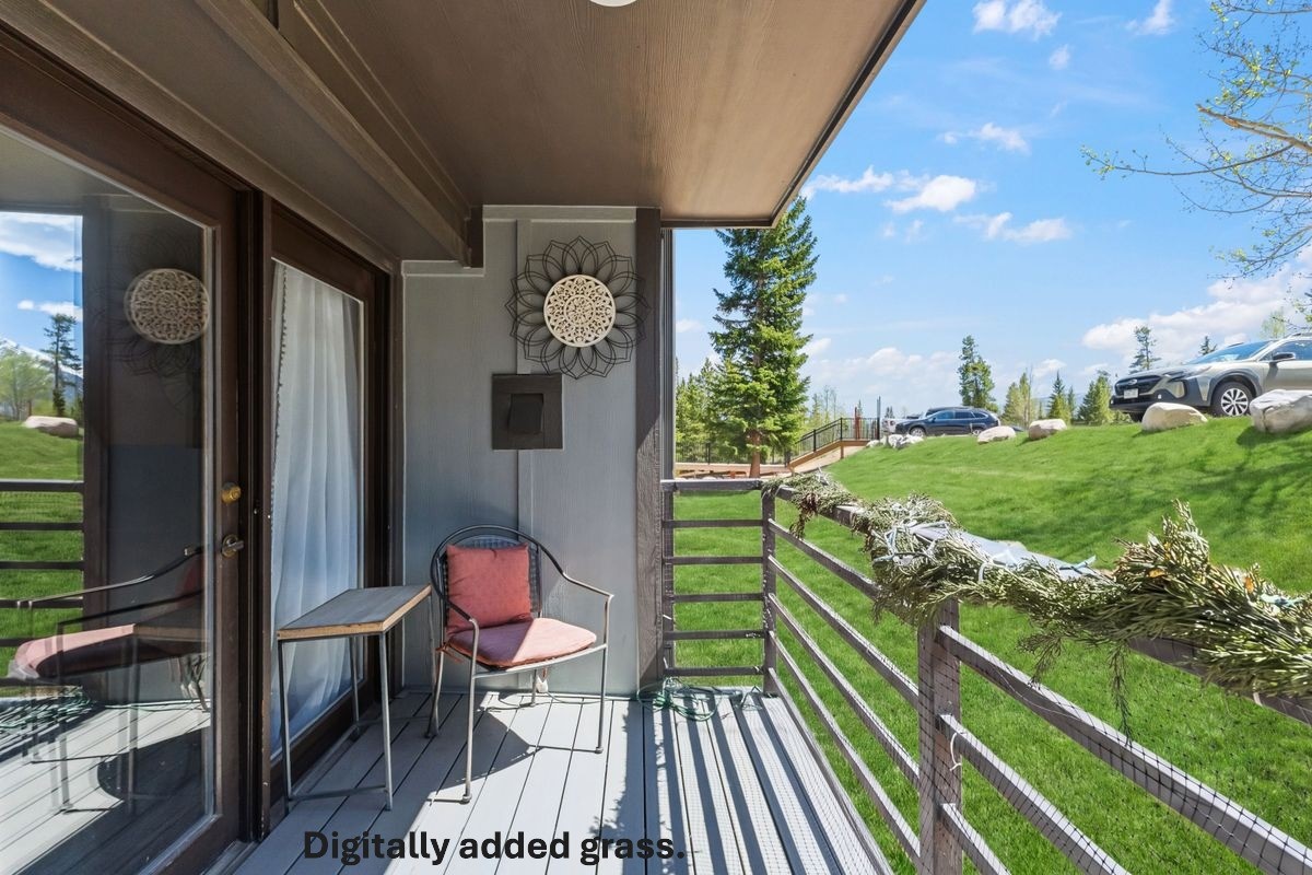 89410 Ryan Gulch Road, Unit 208 Silverthorne, CO 80498 - Photo 19 of 30 a patio with table and chairs and potted plants
