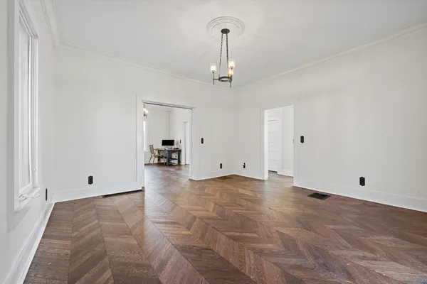 a view of empty room with ceiling fan