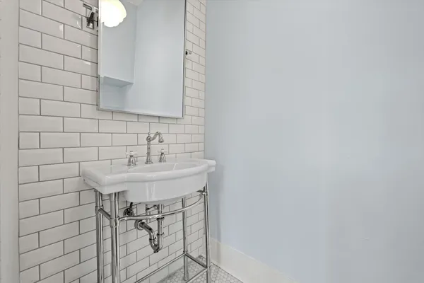 a bathroom with a sink and a mirror