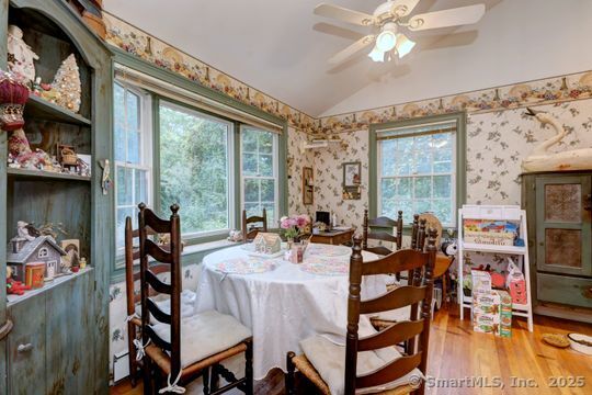 161 Jockey Hollow Road Monroe, CT 06468 - Photo 13 of 37 a view of a dining room with furniture and a floor to ceiling window