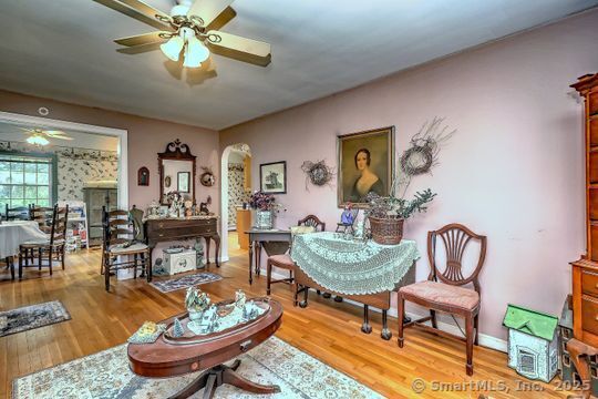 161 Jockey Hollow Road Monroe, CT 06468 - Photo 16 of 37 a living room with furniture and a chandelier