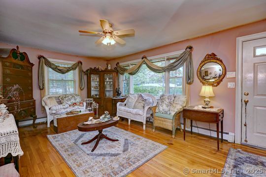 161 Jockey Hollow Road Monroe, CT 06468 - Photo 18 of 37 a living room with furniture and a large window
