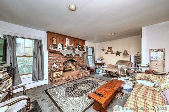 161 Jockey Hollow Road Monroe, CT 06468 - Photo 21 of 37 a living room with lots of furniture and a rug
