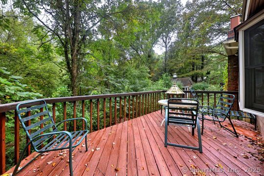 161 Jockey Hollow Road Monroe, CT 06468 - Photo 33 of 37 a view of balcony with chairs and wooden fence