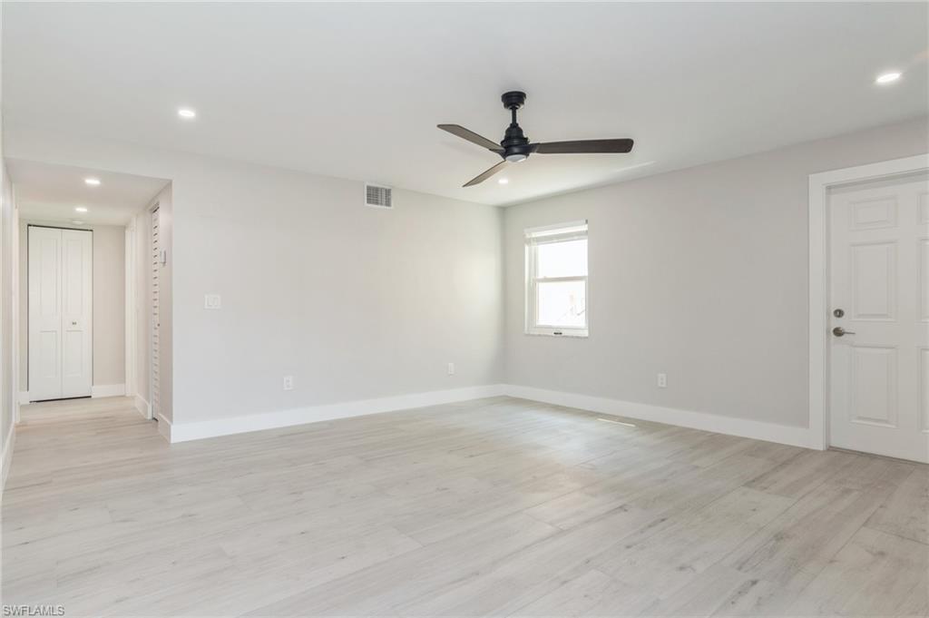 1155 Sandpiper Street, Unit B3 Naples, FL 34102 - Photo 1 of 21 Spare room featuring ceiling fan, light wood finished floors, and recessed lighting