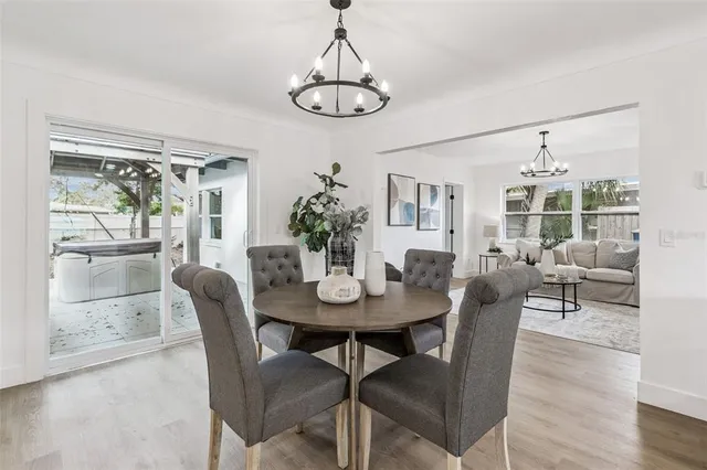 a bathroom with a double vanity sink toilet mirror and shower