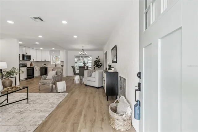 a living room with furniture white walls and white walls