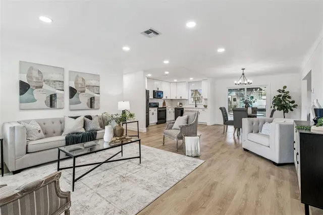 a living room with furniture and white walls