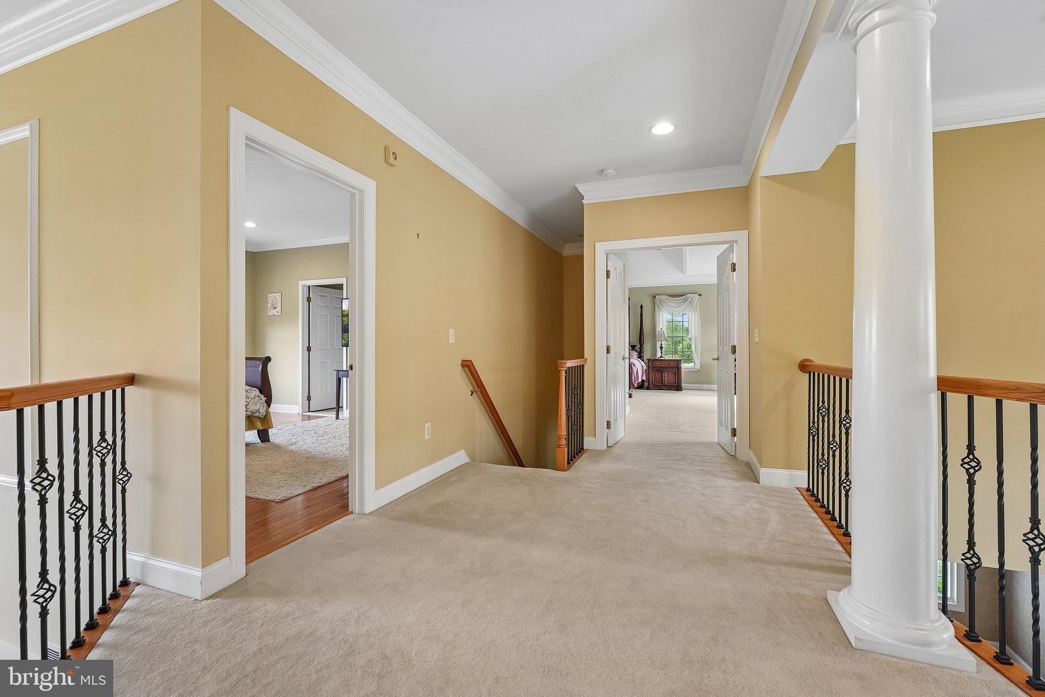 1 Baker Way Pennington, NJ 08534 - Photo 46 of 77 a view of a hallway with wooden floor and a living room