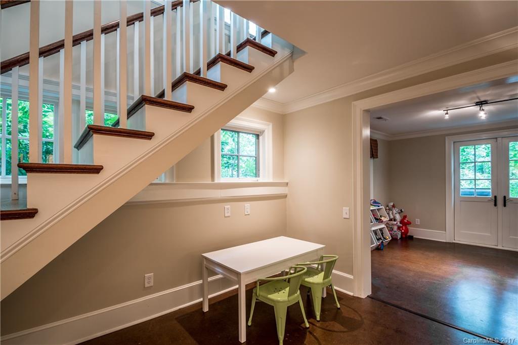 2141 Sagamore Road Charlotte, NC 28209 - Photo 11 of 24 a view of a hallway with furniture and wooden floor
