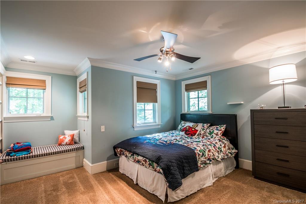 2141 Sagamore Road Charlotte, NC 28209 - Photo 19 of 24 a bedroom with a bed and dresser