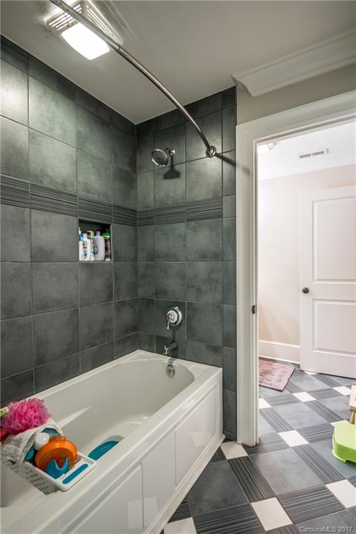 2141 Sagamore Road Charlotte, NC 28209 - Photo 20 of 24 a bathroom with a tub and shower
