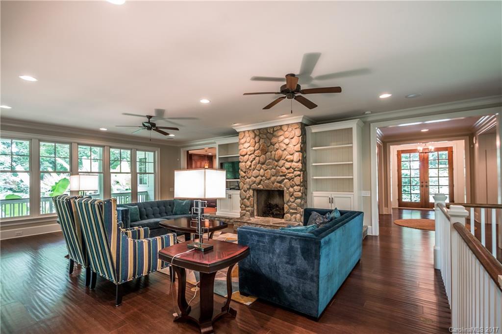 2141 Sagamore Road Charlotte, NC 28209 - Photo 9 of 24 a living room with furniture a fireplace and a floor to ceiling window