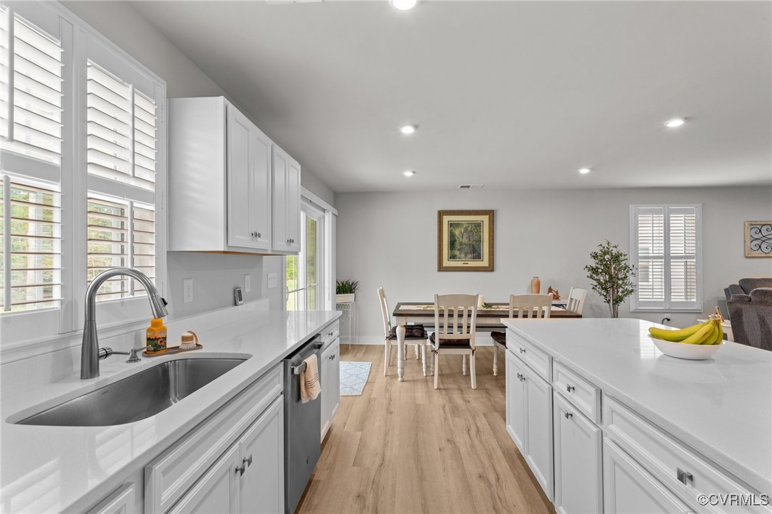 8106 West Danube Loop New Kent, VA 23124 - Photo 13 of 48 a kitchen with a sink stove and cabinets