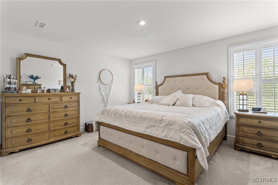 8106 West Danube Loop New Kent, VA 23124 - Photo 19 of 48 a bed room with a bed and a dresser