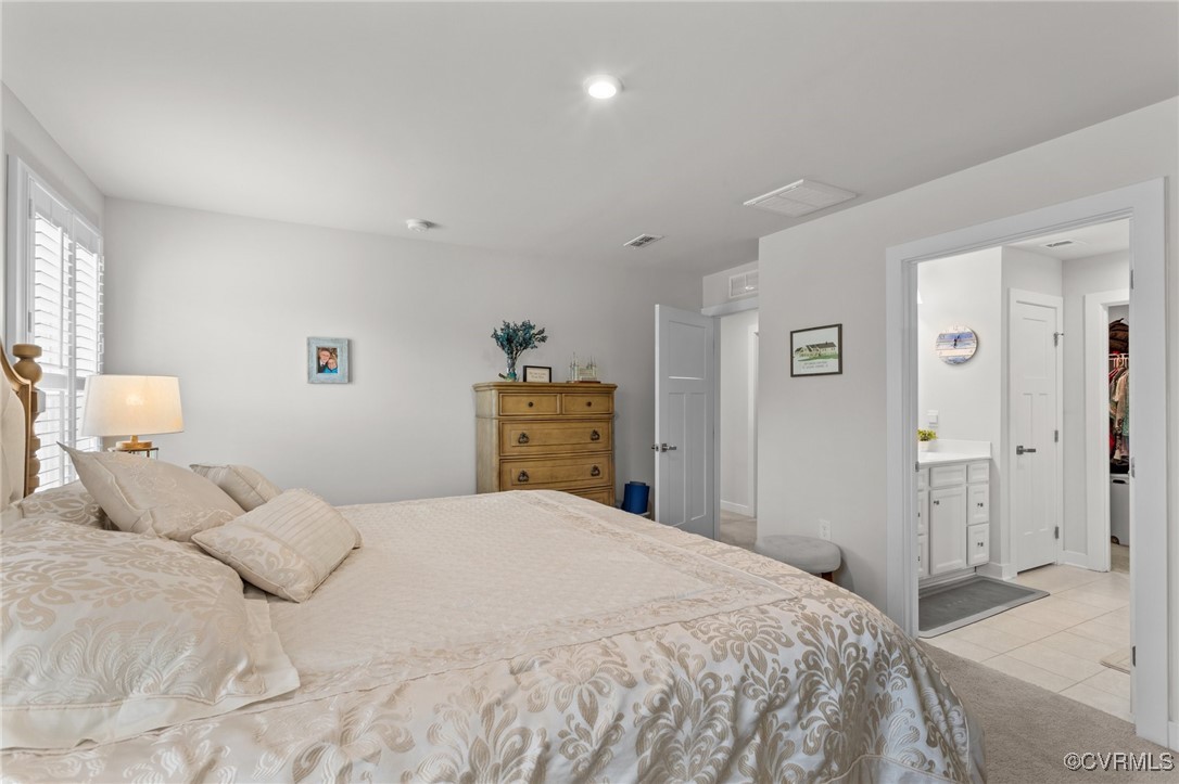8106 West Danube Loop New Kent, VA 23124 - Photo 21 of 48 a bedroom with a bed and a cabinets