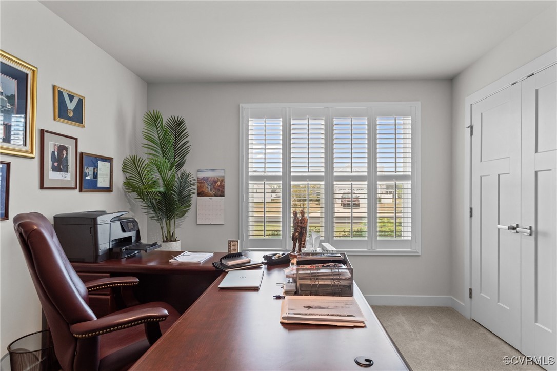8106 West Danube Loop New Kent, VA 23124 - Photo 26 of 48 a living room with furniture and a window