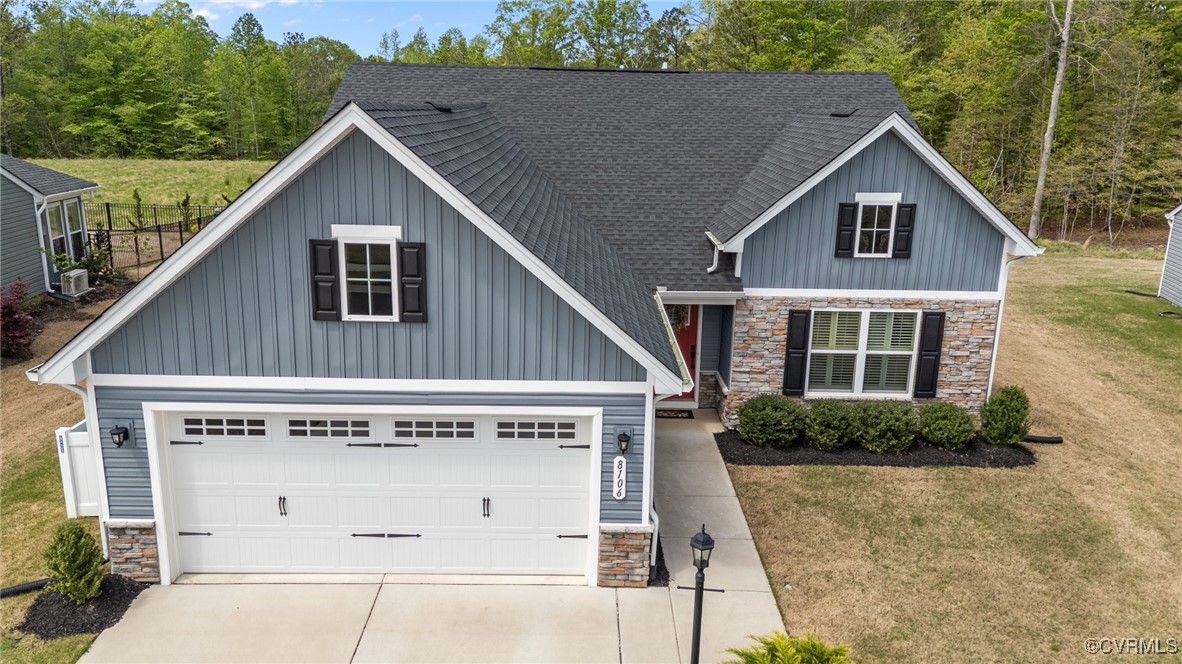 8106 West Danube Loop New Kent, VA 23124 - Photo 3 of 48 a view of a house with a wooden fence