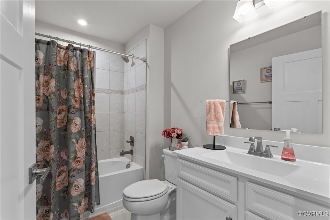 8106 West Danube Loop New Kent, VA 23124 - Photo 31 of 48 a bathroom with a sink toilet vanity and shower