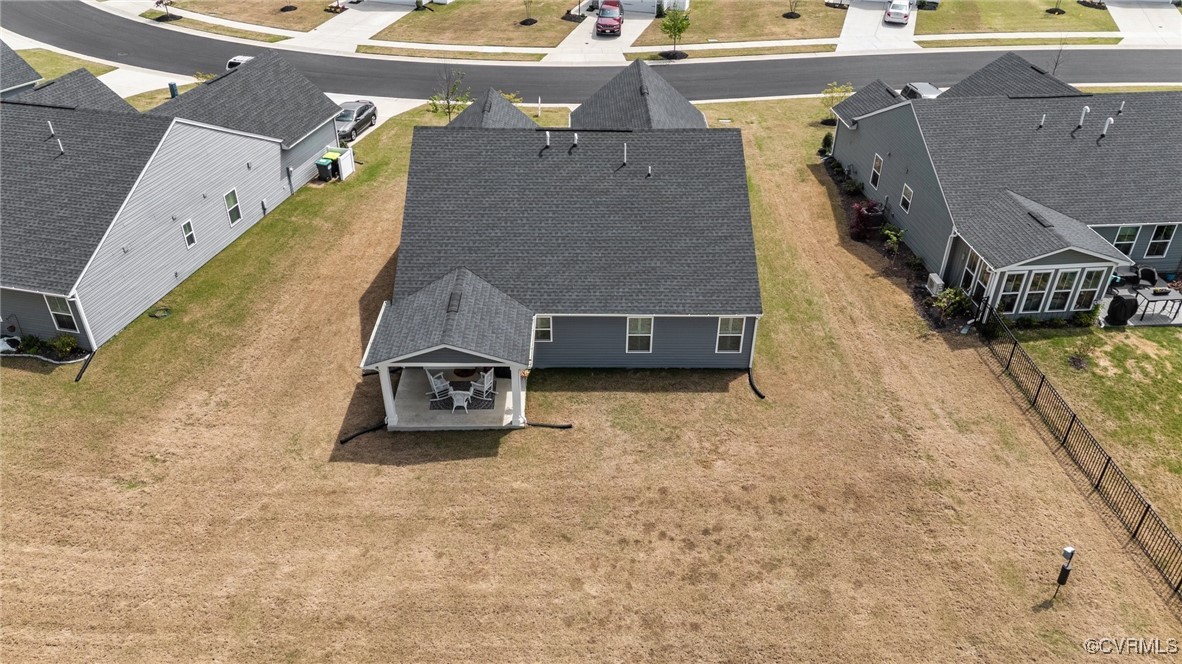 8106 West Danube Loop New Kent, VA 23124 - Photo 37 of 48 an aerial view of a house with a yard