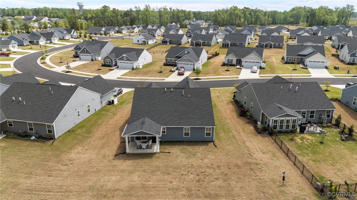 8106 West Danube Loop New Kent, VA 23124 - Photo 38 of 48 an aerial view of a swimming pool with seating space