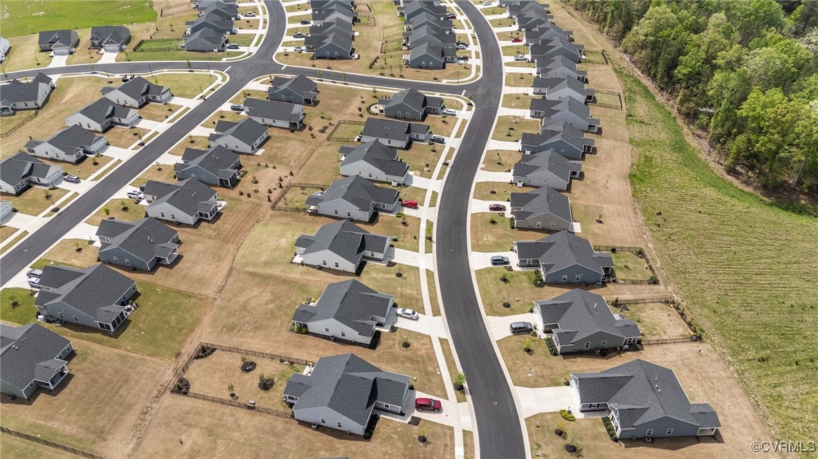 8106 West Danube Loop New Kent, VA 23124 - Photo 42 of 48 an aerial view of residential houses with outdoor space