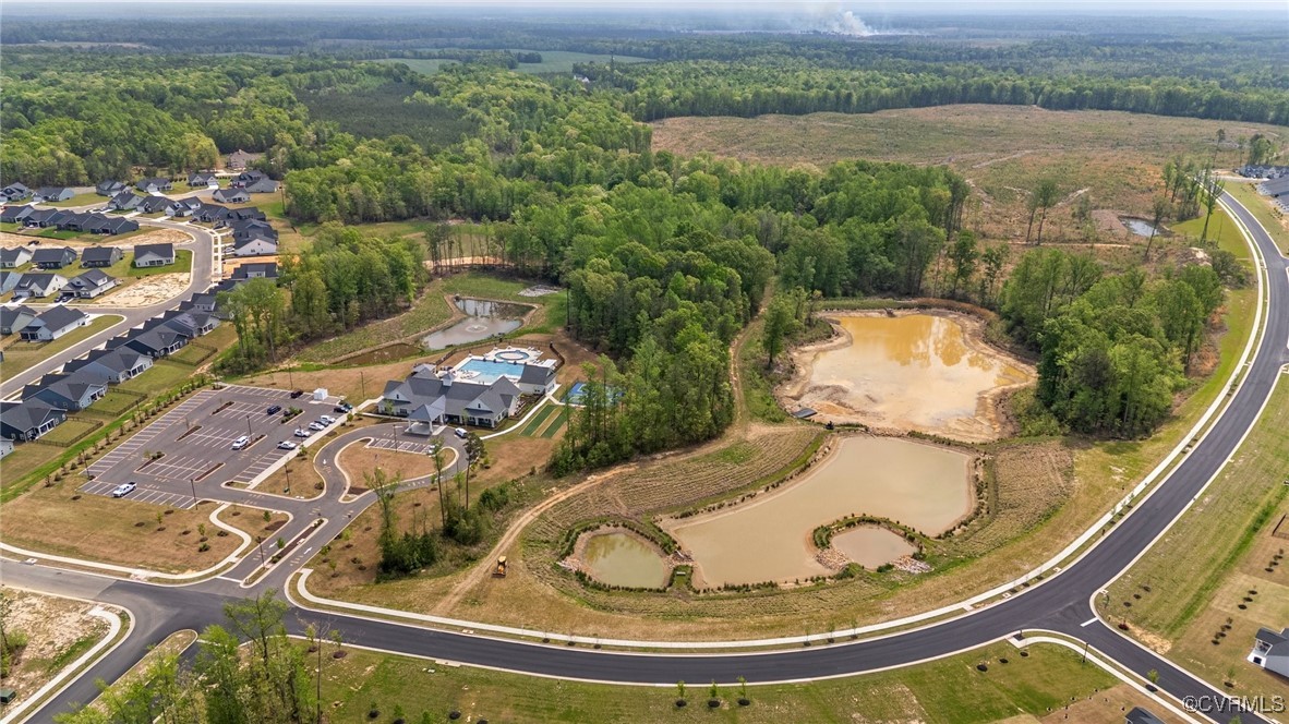 8106 West Danube Loop New Kent, VA 23124 - Photo 43 of 48 an aerial view of a house with a yard and lake view