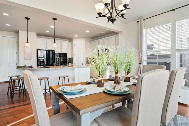 a view of a dining room with furniture window and wooden floor
