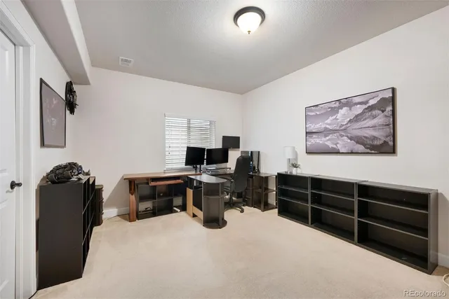 a bedroom with a workspace