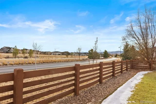 a view of a house with swimming pool in front of it