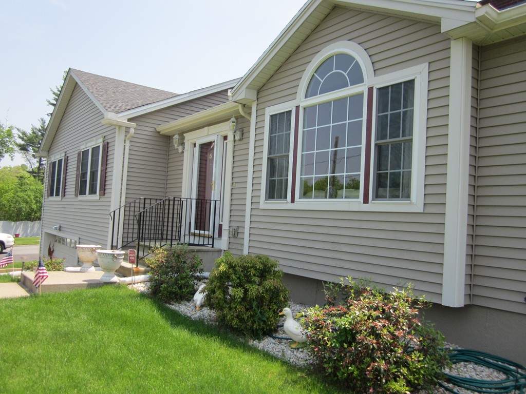 5 Woodland Road Springfield, MA 01129 - Photo 2 of 30 a front view of a house with garden