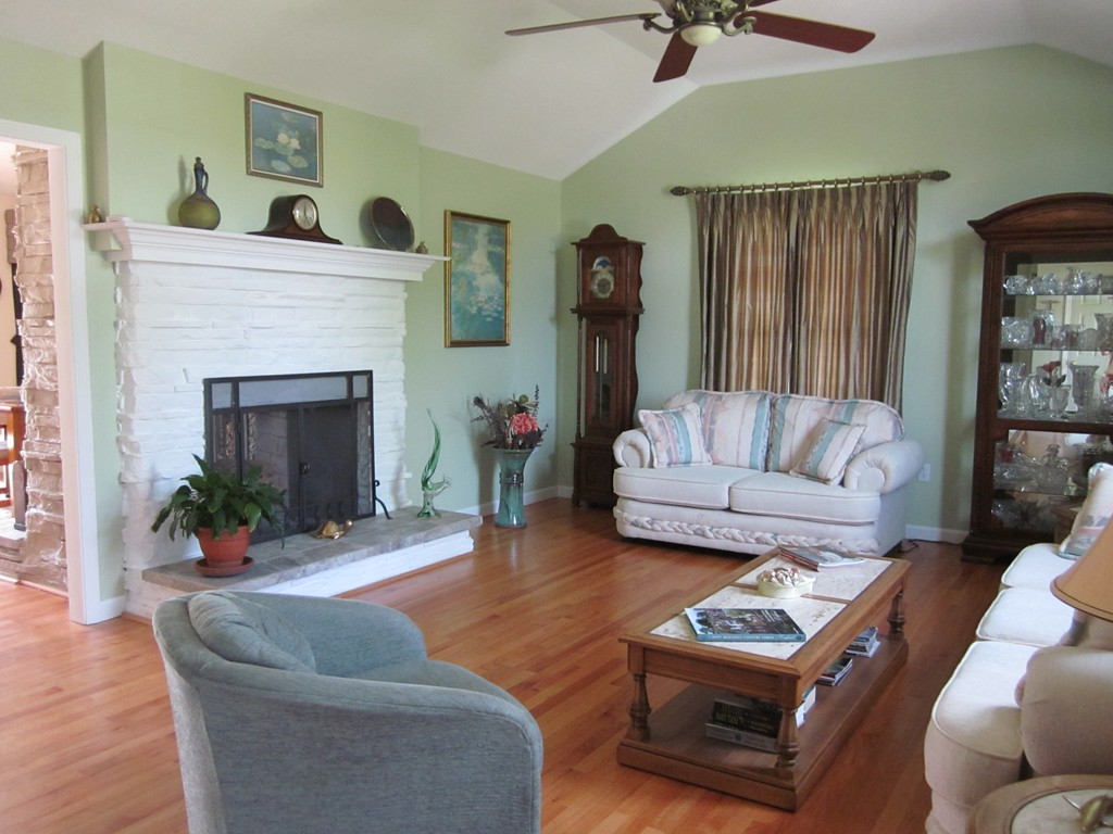 5 Woodland Road Springfield, MA 01129 - Photo 4 of 30 a living room with furniture and a fireplace