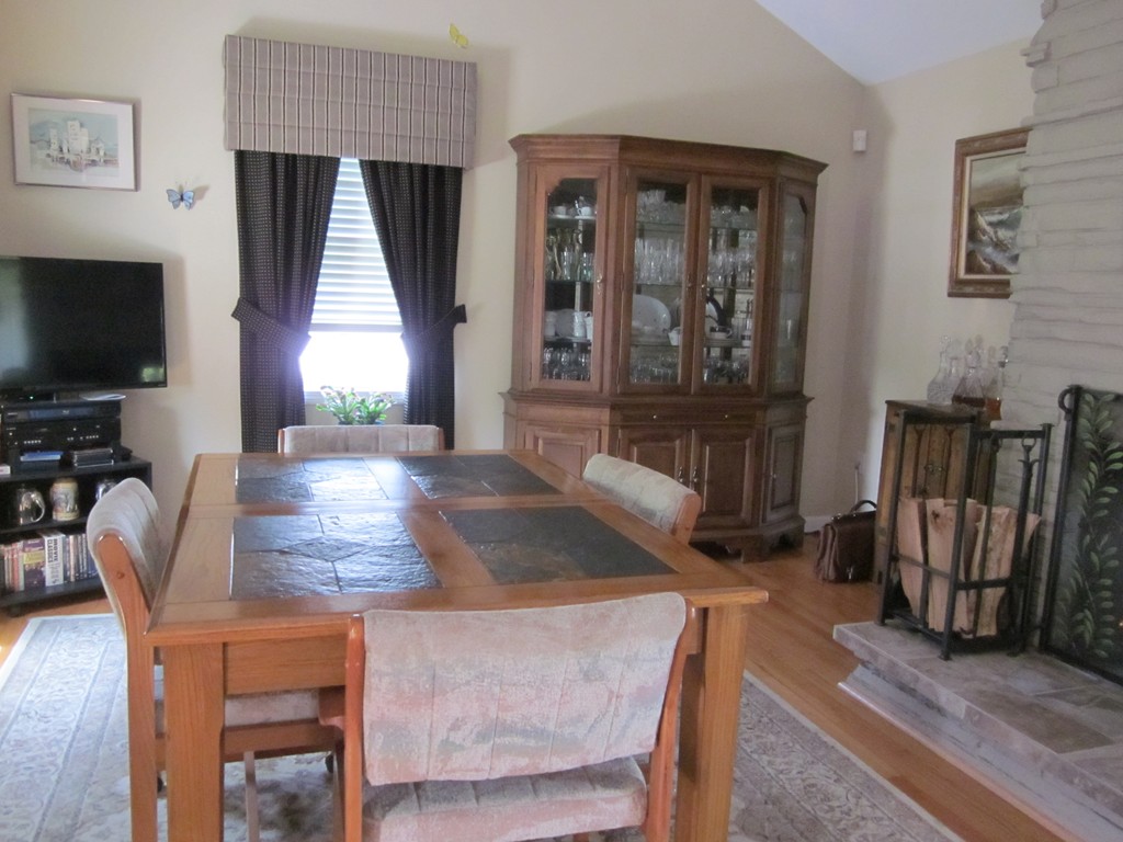 5 Woodland Road Springfield, MA 01129 - Photo 8 of 30 a living room with furniture a flat screen tv and a large window