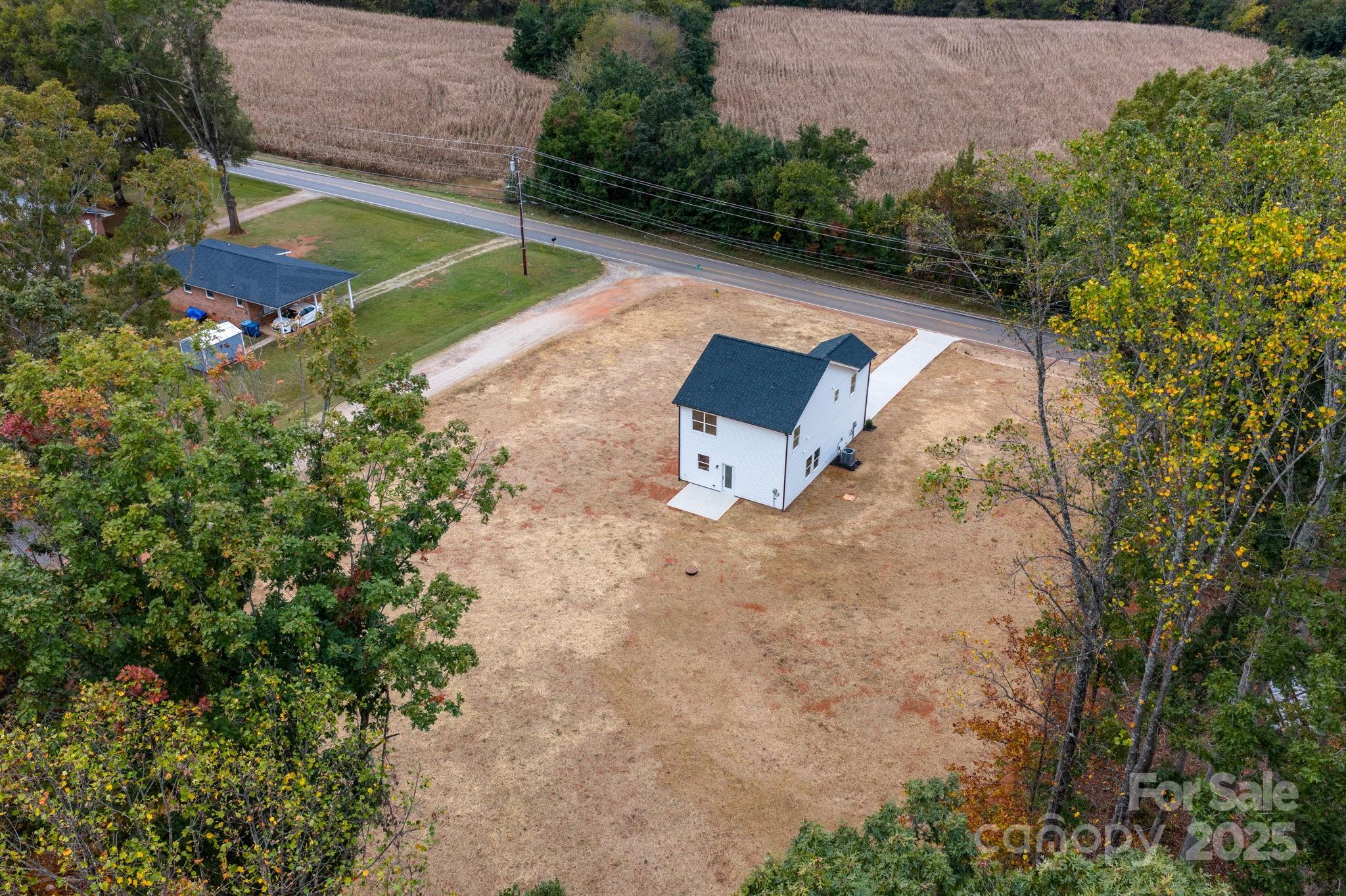 1888 Sigmon Dairy Road Newton, NC 28658 - Photo 24 of 38 an aerial view of a house with a yard and trees all around