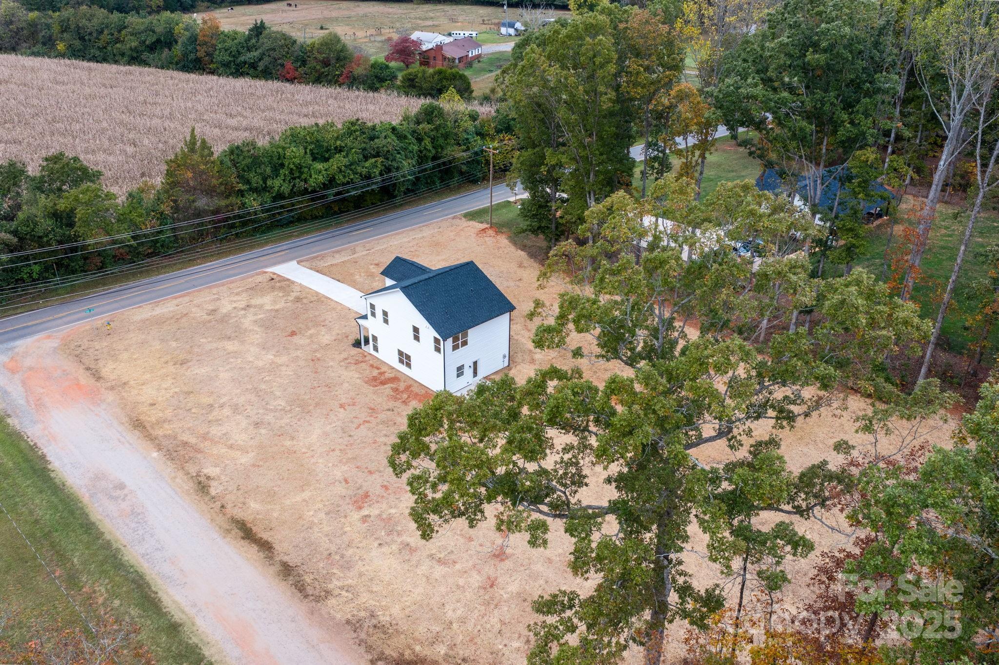 1888 Sigmon Dairy Road Newton, NC 28658 - Photo 25 of 38 a view of a lake with a house in the background