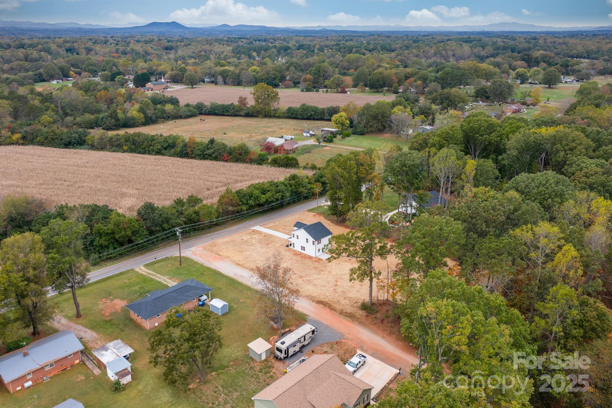 1888 Sigmon Dairy Road Newton, NC 28658 - Photo 26 of 38 an aerial view of residential houses with outdoor space and city view