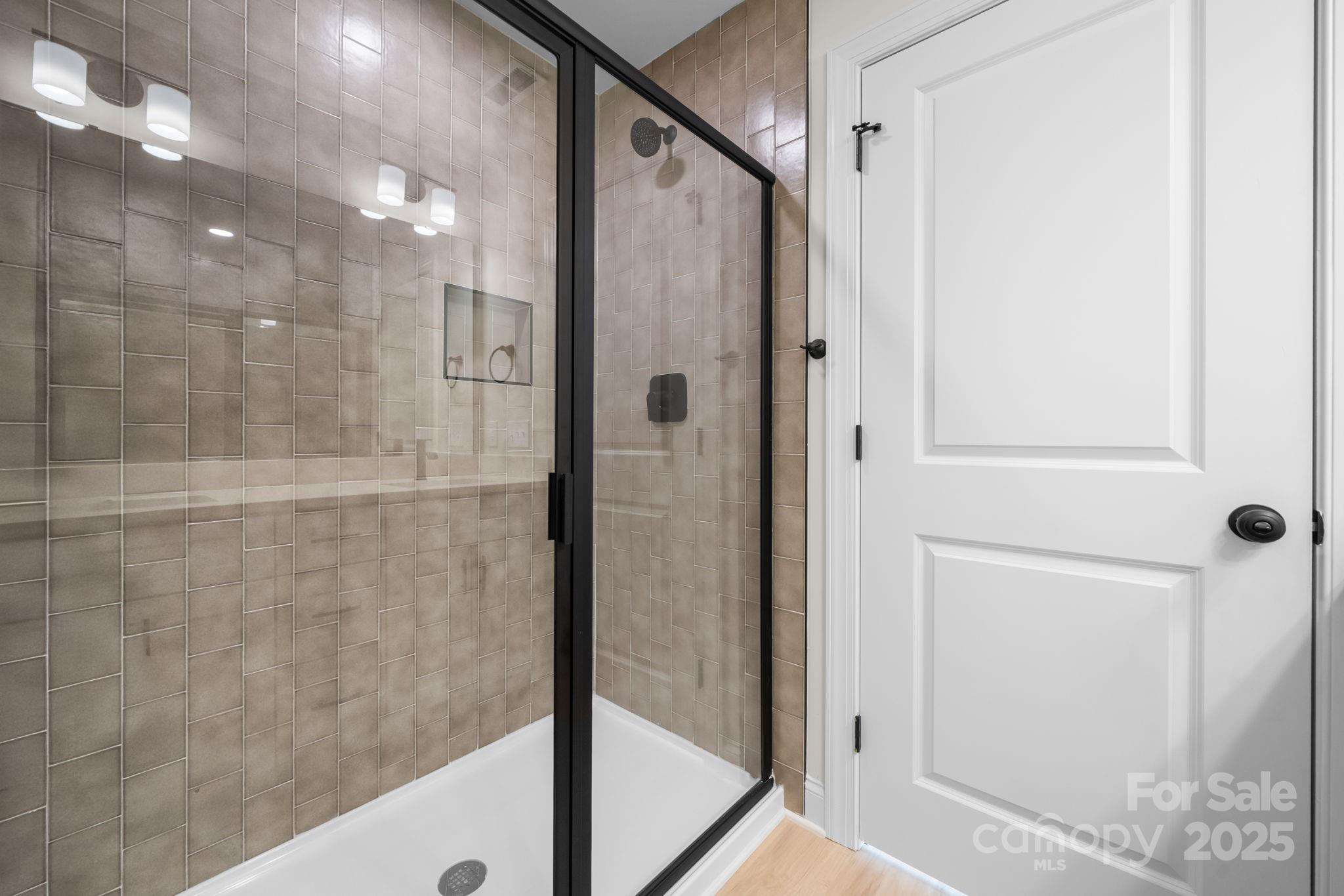 1888 Sigmon Dairy Road Newton, NC 28658 - Photo 3 of 38 a bathroom with a shower and a glass door