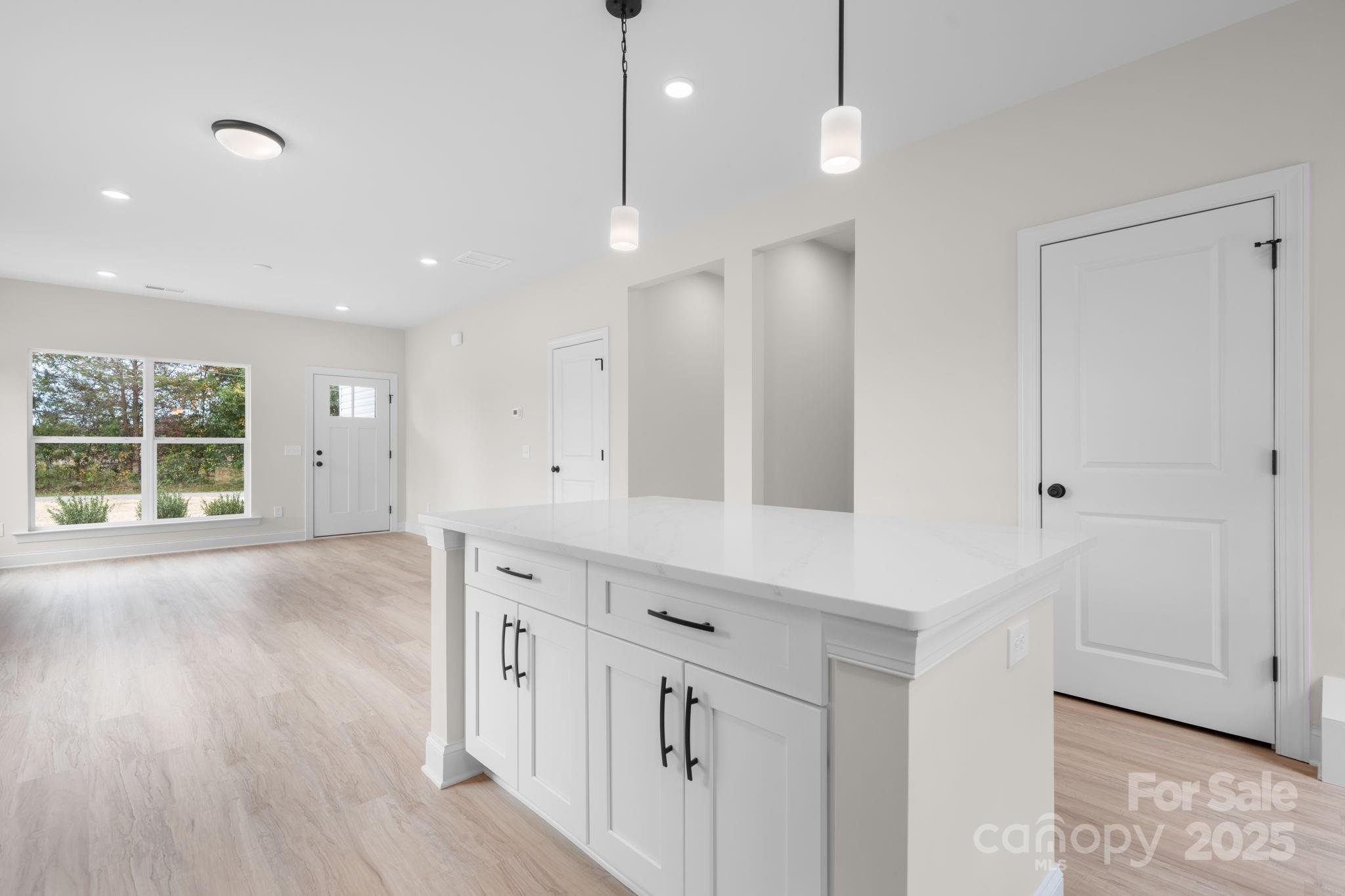 1888 Sigmon Dairy Road Newton, NC 28658 - Photo 4 of 38 a view of a kitchen with a sink and wooden floor