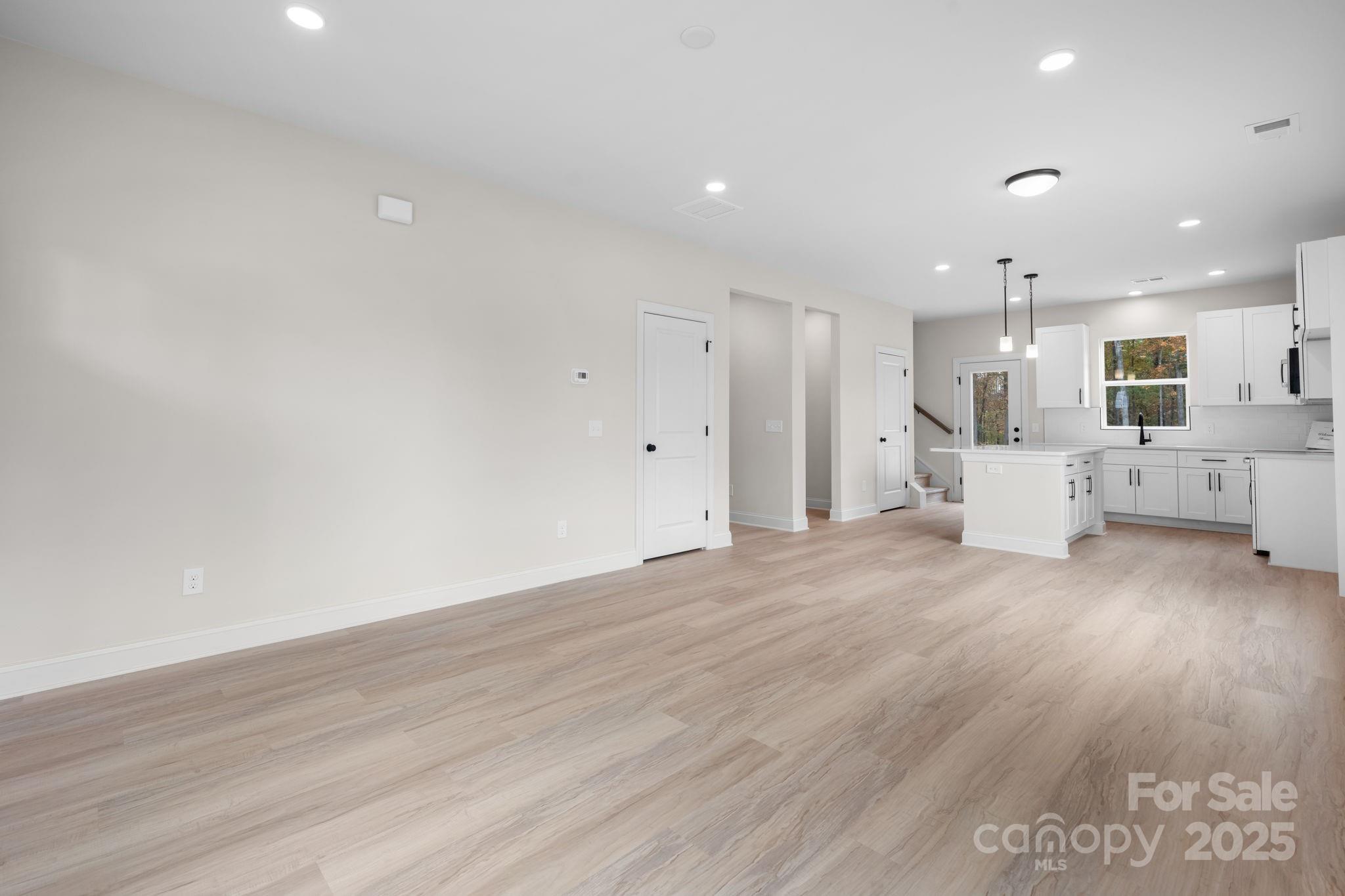 1888 Sigmon Dairy Road Newton, NC 28658 - Photo 8 of 38 a view of a kitchen with furniture and wooden floor
