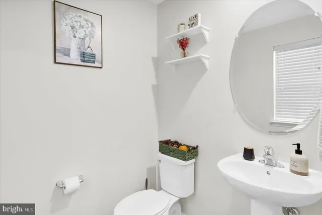 a bathroom with a toilet and a sink
