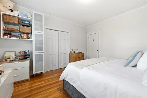a bedroom with a bed and closet