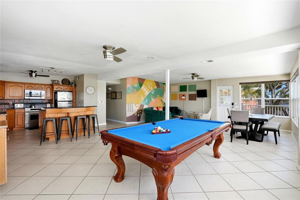 2311 Bay Boulevard Indian Rocks Beach, FL 33785 - Photo 47 of 80 a view of dining room with furniture and chandelier