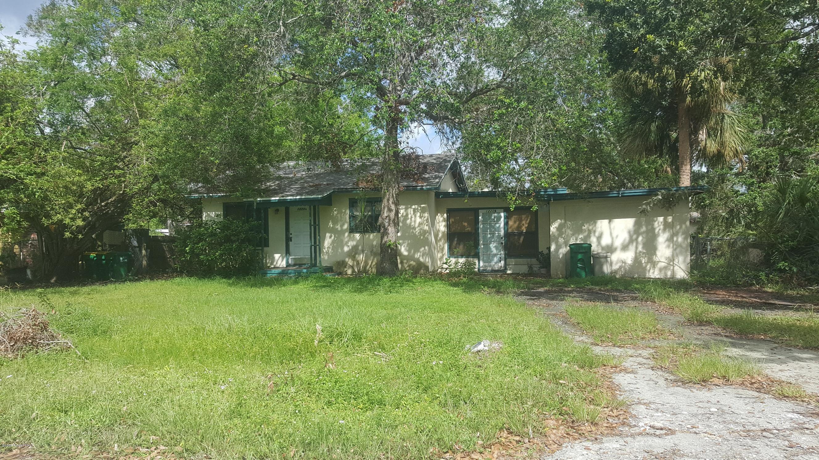 1220 Fern Street Cocoa, FL 32922 - Photo 1 of 4 a front view of a house with garden