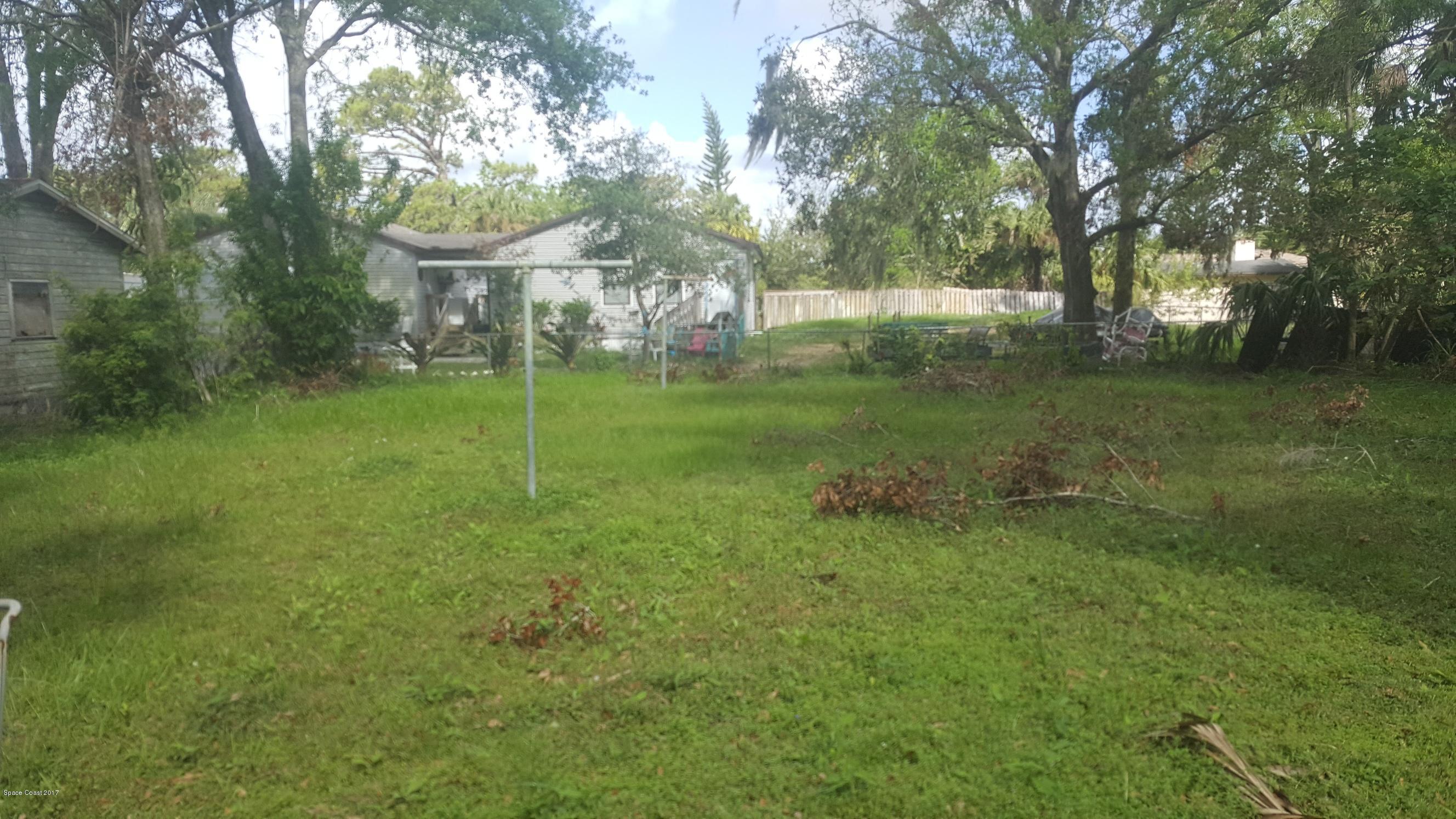 1220 Fern Street Cocoa, FL 32922 - Photo 2 of 4 a view of a park with large trees