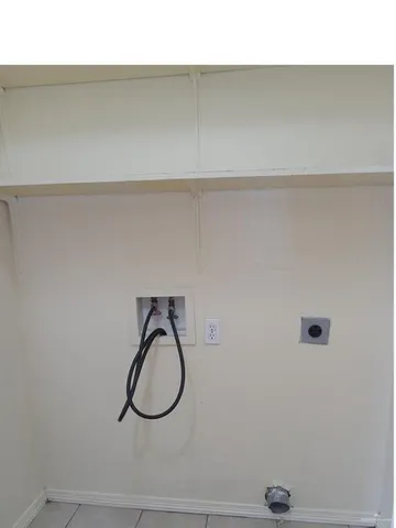 a bathroom with a shower and a sink