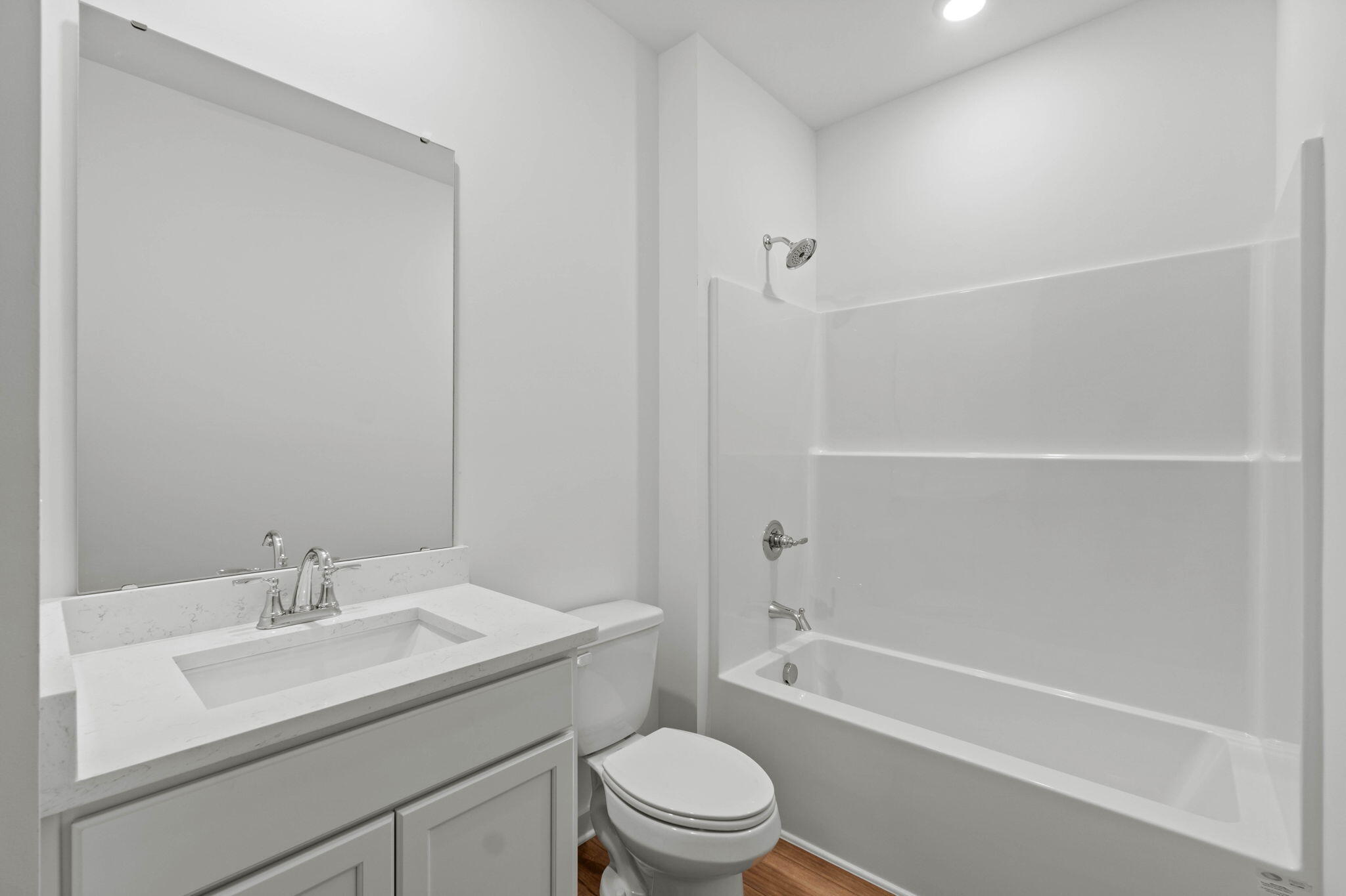 165 Sweetclover Street Freeport, FL 32439 - Photo 19 of 34 a bathroom with a sink toilet and shower